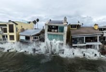 Waves from post-tropical cyclone Rachel crash into beachfront homes in Long Beach, Calif on Monday
