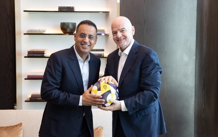 Ahmed Yahya (left) with Gianni Infantino
