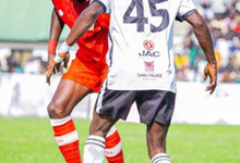 Swedru All Blacks' William Jnr is confronted by a Kotoko marker in Saturday's thrilling encounter