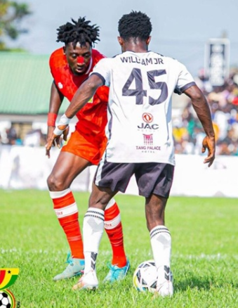 Swedru All Blacks' William Jnr is confronted by a Kotoko marker in Saturday's thrilling encounter
