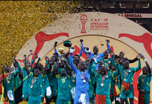 Senegal's Sadio Mane lifts the trophy with teammates as they celebrate after winning