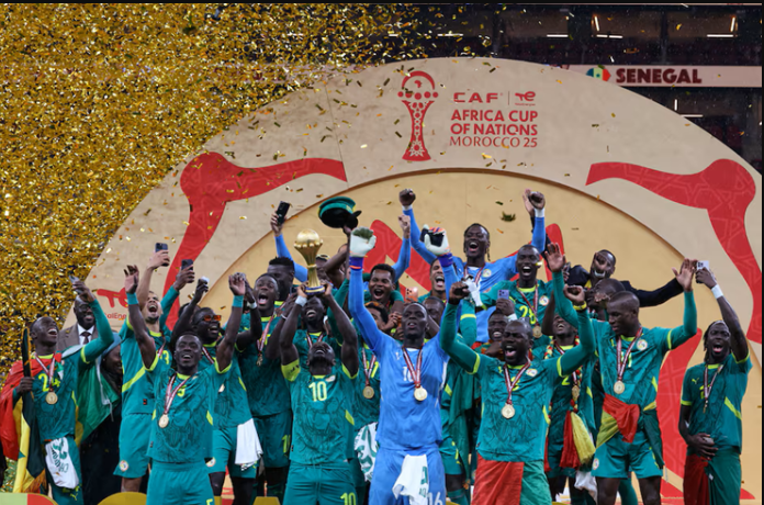 Senegal's Sadio Mane lifts the trophy with teammates as they celebrate after winning