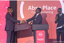 Dr. Botchway (left) receiving the certification at the ceremony