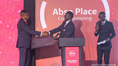 Dr. Botchway (left) receiving the certification at the ceremony