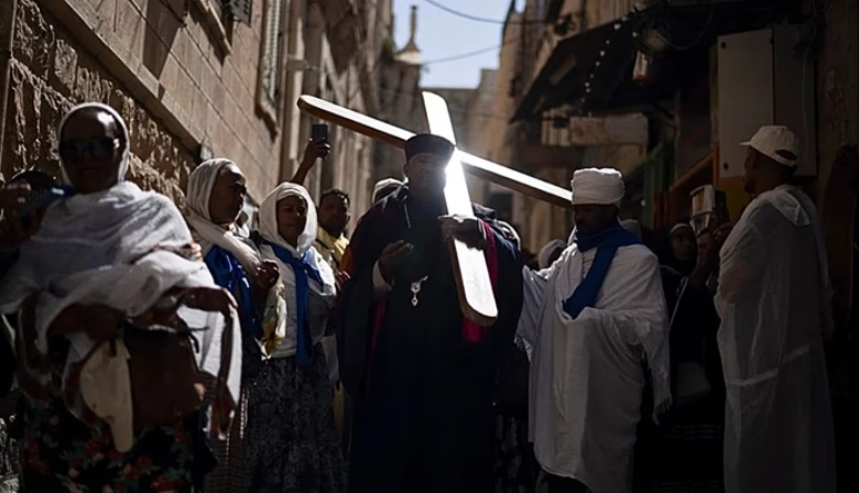Ethiopian Orthodox Christian worshippers walk the Way of the Cross procession that commemorates Jesus Christ's
