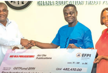• Mr Peter Asiedu (middle) presenting a dummy cheque to Mr Dandaawa