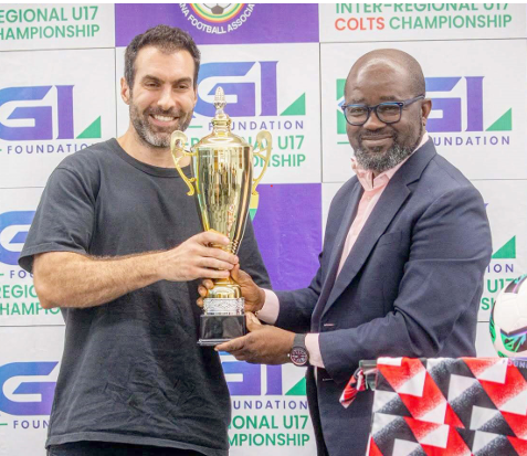 • Mr Salamouni presenting one of the trophies to Mr Simeon-Okraku at the launch