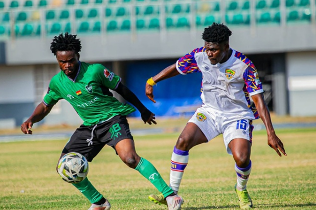 Hearts' Dominic Nsobila (right) in a battle for the ball with Shaibu Abdullah